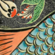Bild eines künstlerisch gestallteten Fisches aus Mosaikkeramik